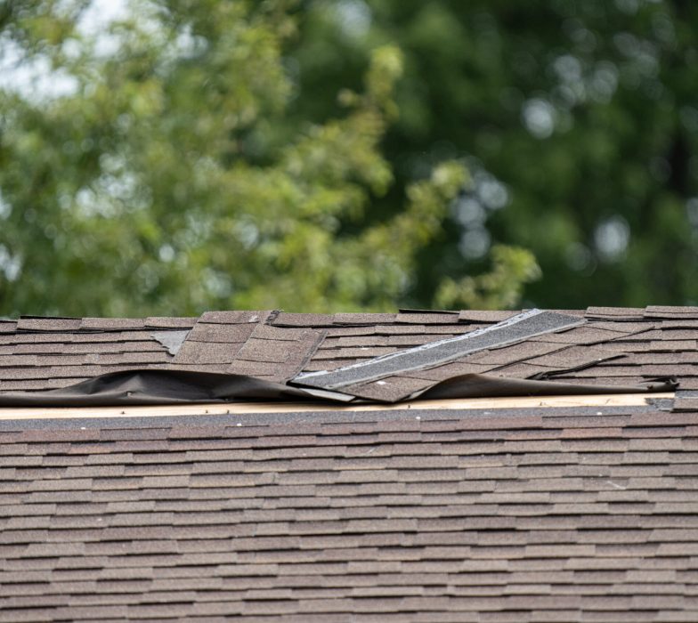 Roof,Shingles,Have,Been,Damaged,By,High,Winds,And,Strong